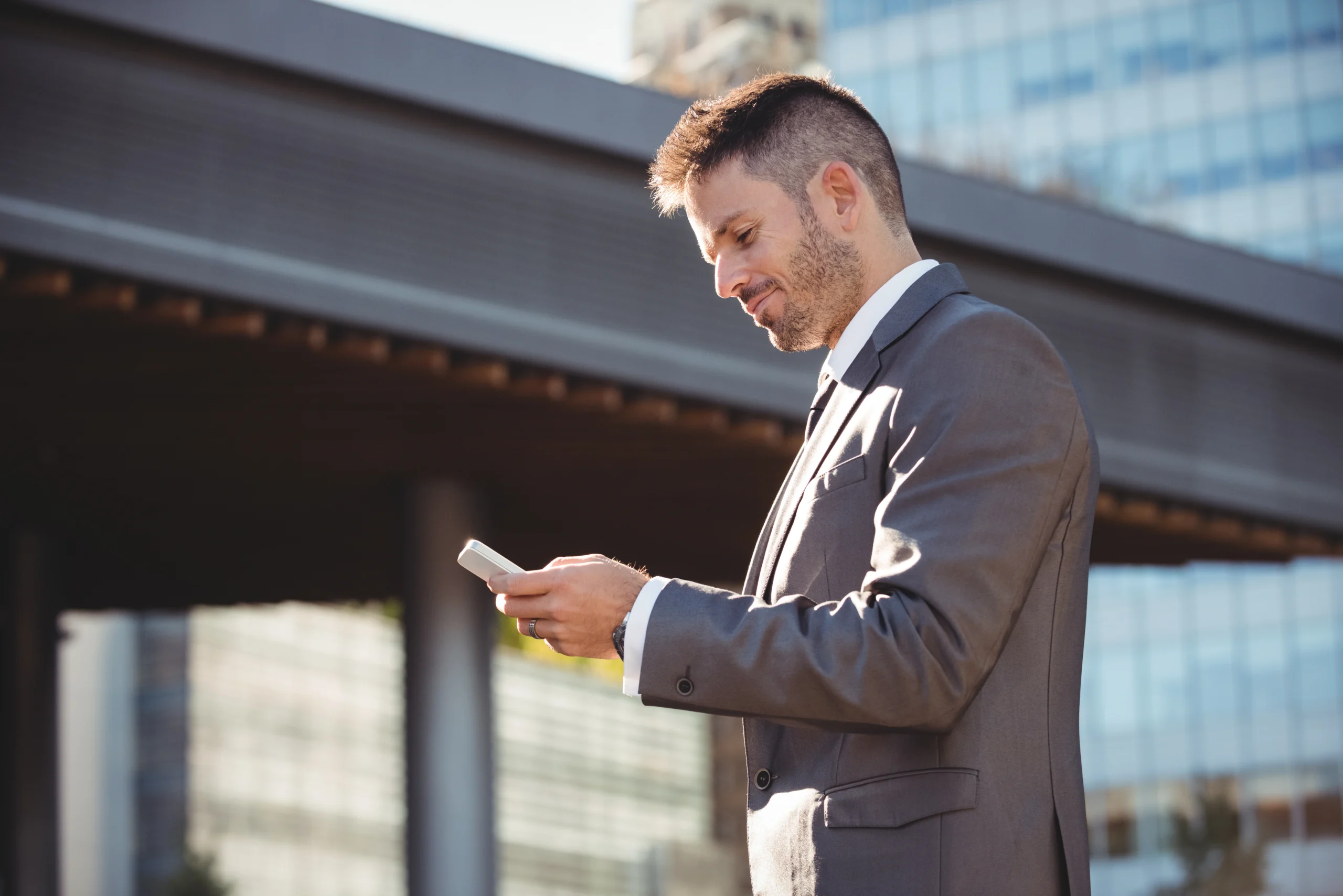 businessman using mobile phone scaled